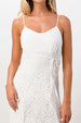 White lace dress worn by a model on a white background