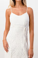 White lace dress worn by a model on a white background