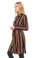 Woman wearing a black and orange striped dress on a white background