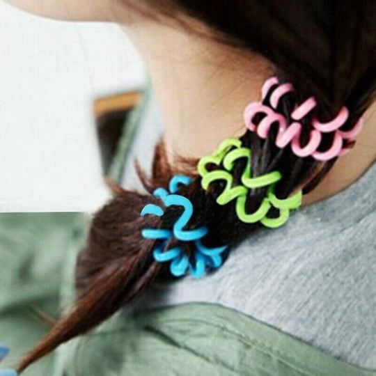 Adjustable mosquito bracelet being placed on a female's hair