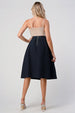 Pleated A-Line Midi Skirt – Pleated Textured Everyday Elegance shown from the back, highlighting its high-waisted design and elegant movement.