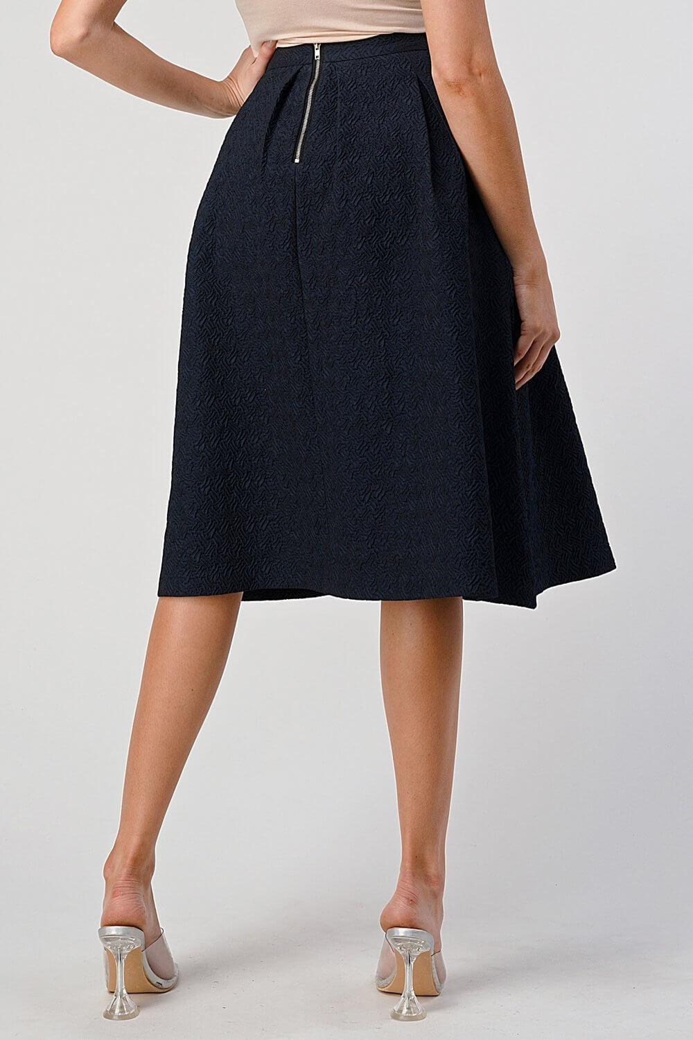 Pleated A-Line Midi Skirt – Pleated Textured Everyday Elegance showcasing a high-waisted silhouette and elegant pleats.