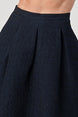 Pleated A-Line Midi Skirt – Pleated Textured Everyday Elegance showcasing pleats and textured fabric in a flattering high-waisted design.