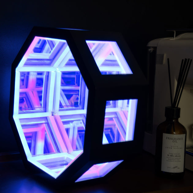 Geometric LED light with colorful design on a dark background