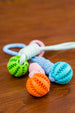 Rubber Chew Toy with Rope – Durable, Interactive Dog Toy, featuring colorful chew balls and durable rope.