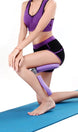 Person using a purple knee support on a blue mat against a white background